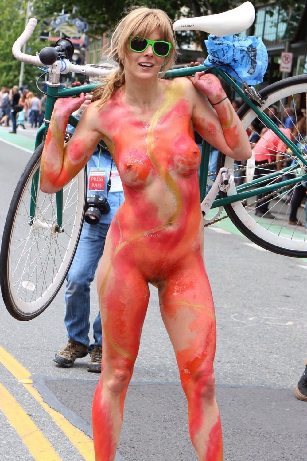 Nudist girls doing body paint in public