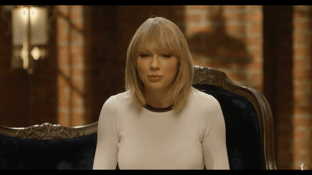 Taylor Swift tight white sweater, leather skirt, leather heels