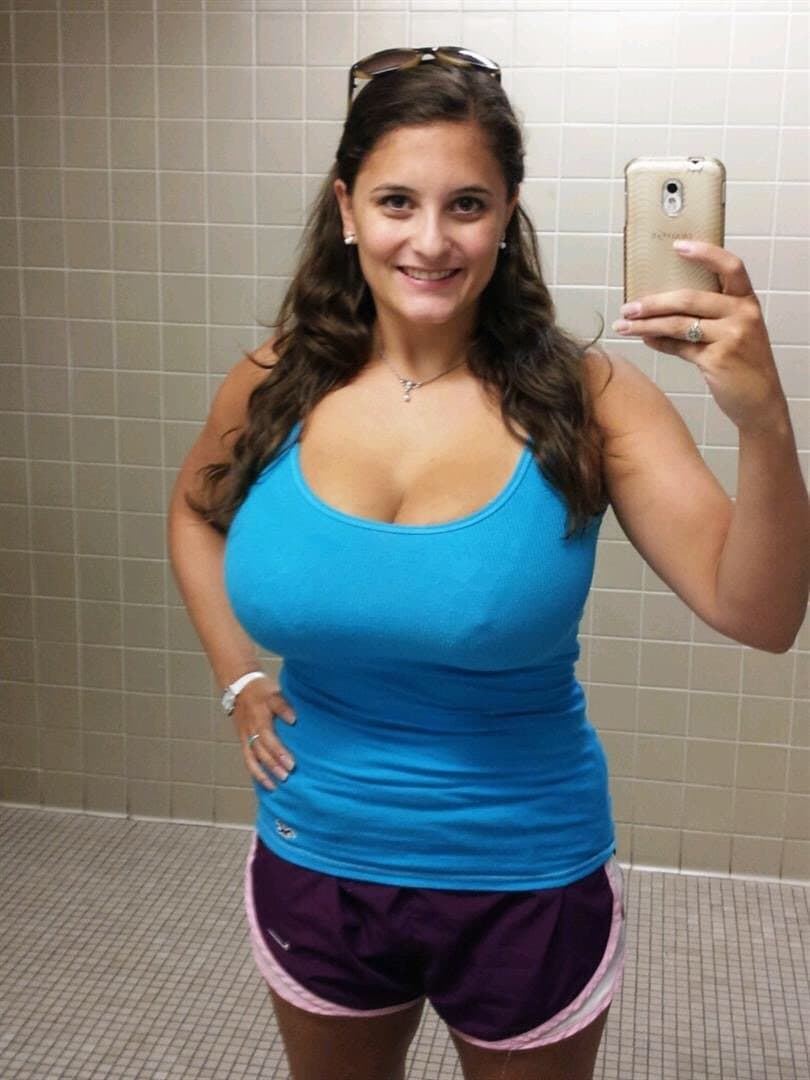 Brunette loves showing off her massive tits (non nude)