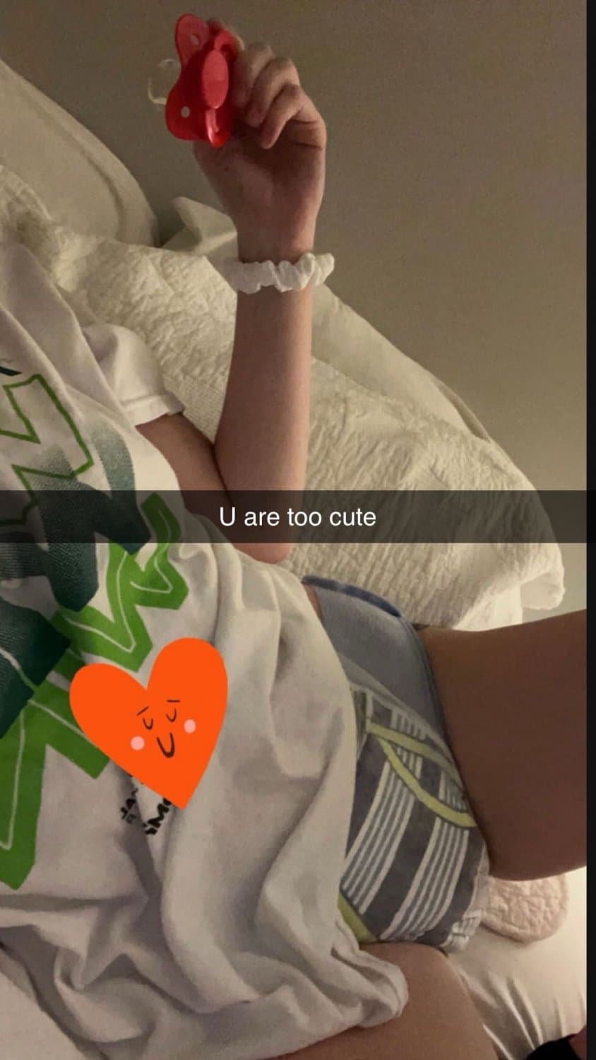 Cute tanned girl shows off her diapers and pull-ups