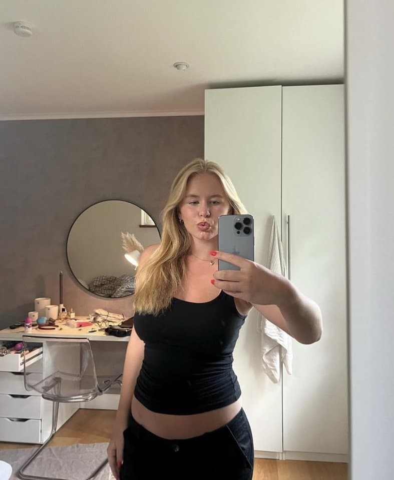 Swedish bitch Alva shows of cleavage from her massive tits