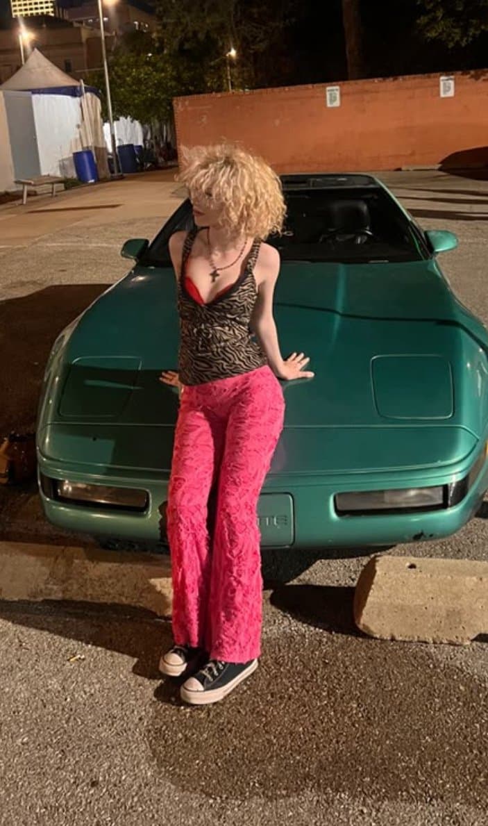 pink haired emo girl arches and shows ass