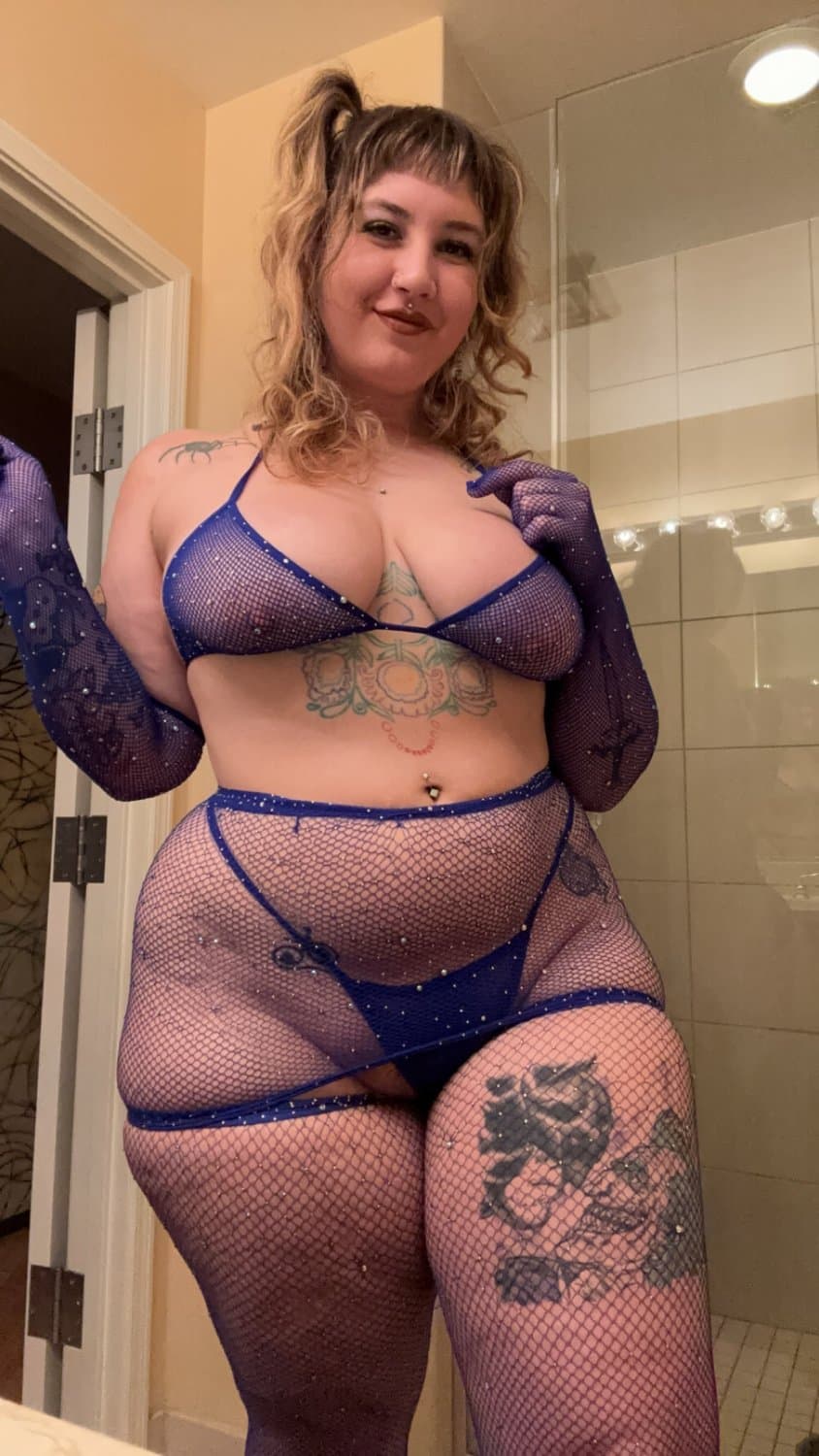Looking real good in the blue fishnets and lingerie