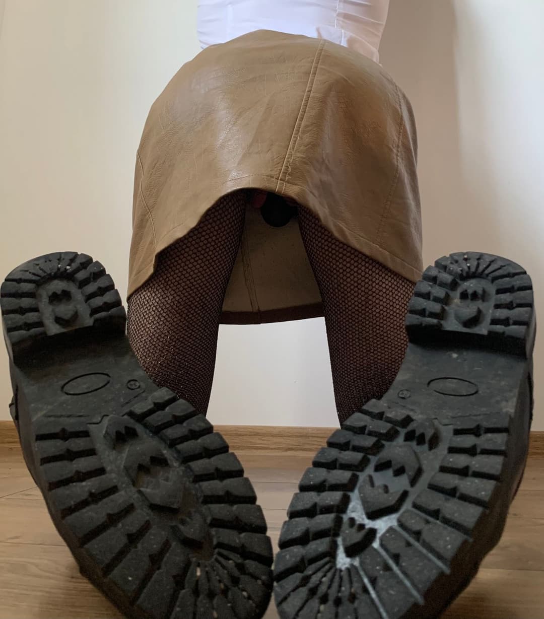 Kate Sissy Cl1412 showing her in leather skirt and fishnets