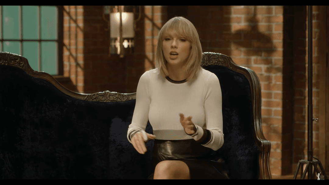 Taylor Swift tight white sweater, leather skirt, leather heels