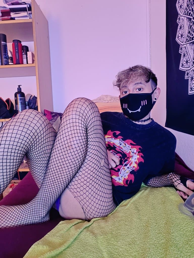 femboy in fishnet plays with hisdildo and shows his feet