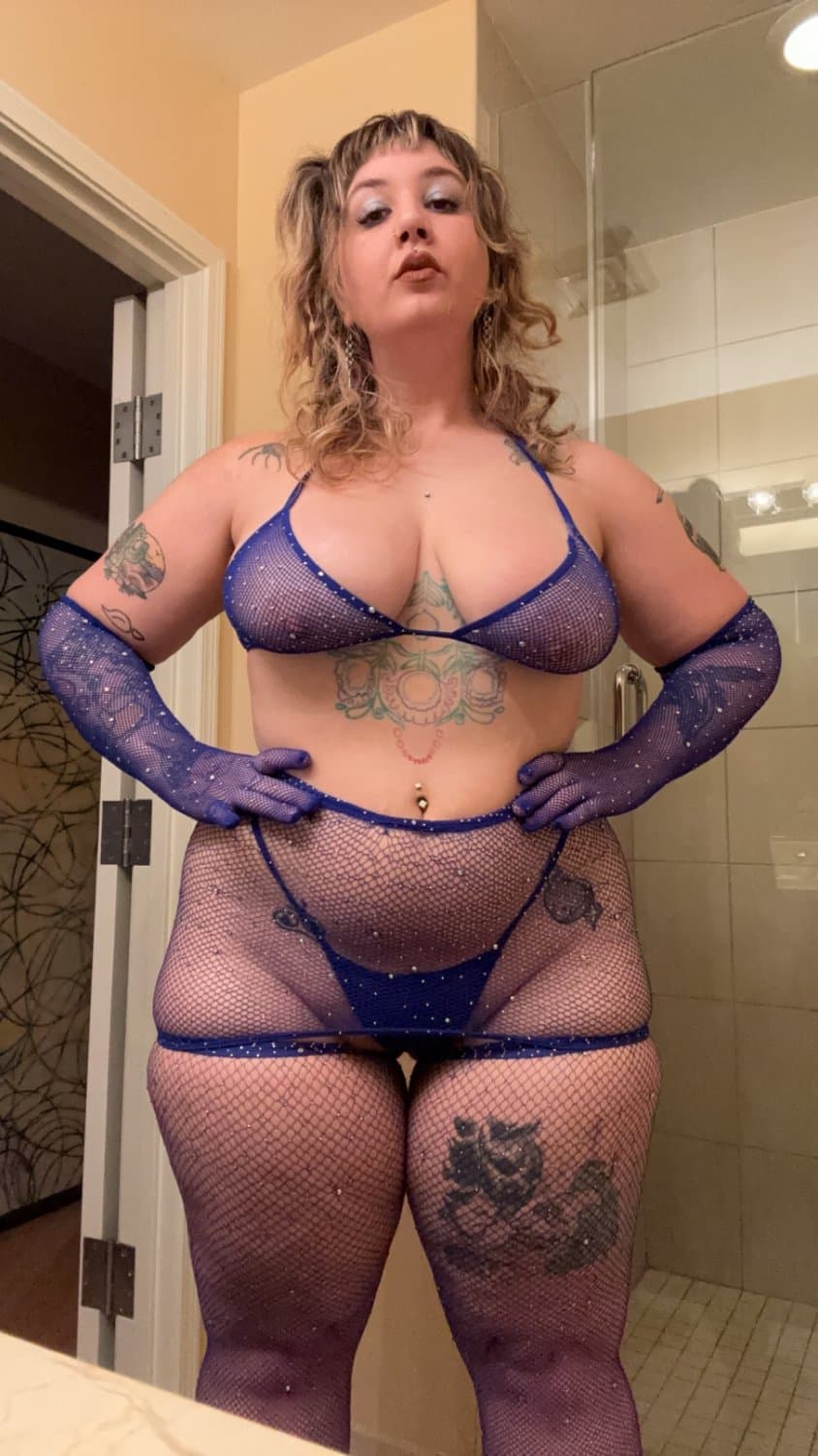 Looking real good in the blue fishnets and lingerie