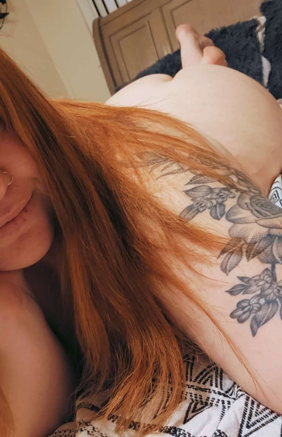Big titty red head milf showing off big ass and tits.
