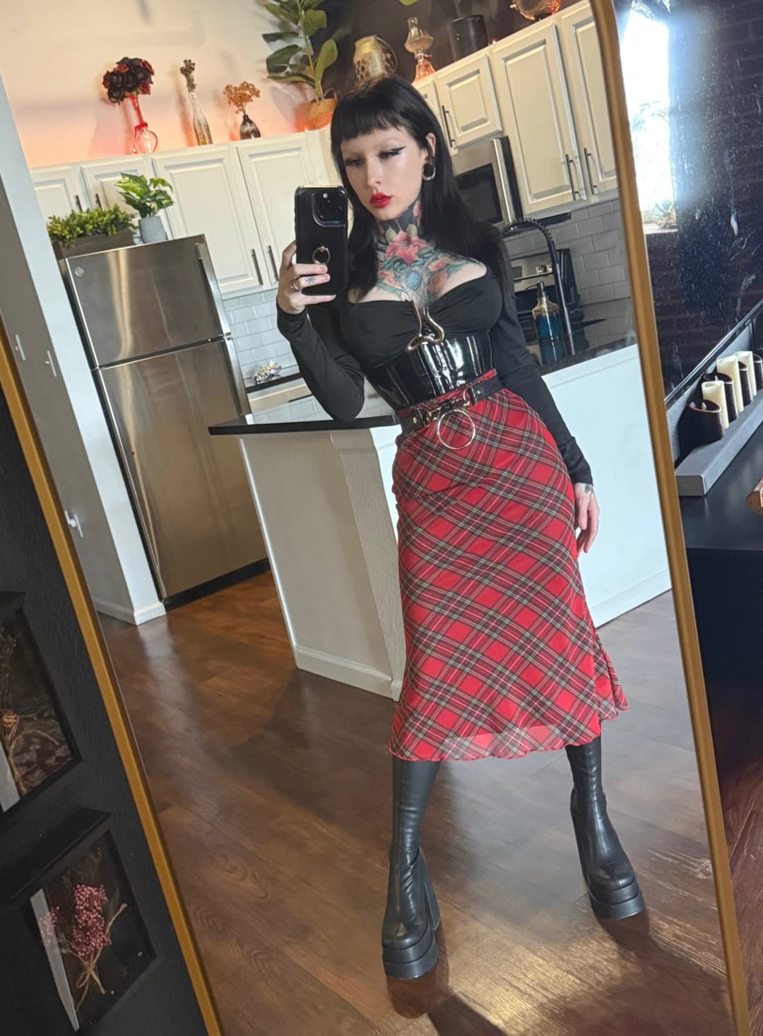 Don’t look at the skirt—look at the boots. Worship them