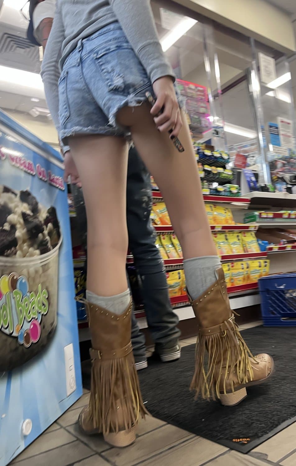 Candid teen in daisy dukes