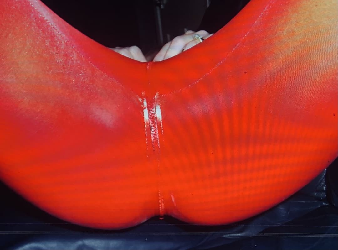 English milf in red pvc cat suit and black high heels  . uk milf in  Black lace panties pussy play