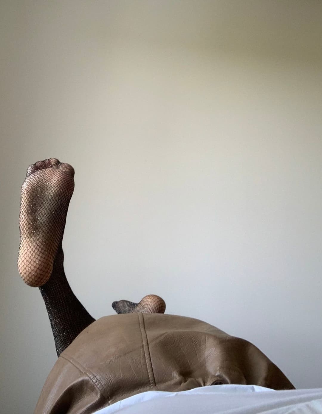 Kate Sissy Cl1412 showing her in leather skirt and fishnets