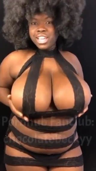 Massive oiled ebony boobs