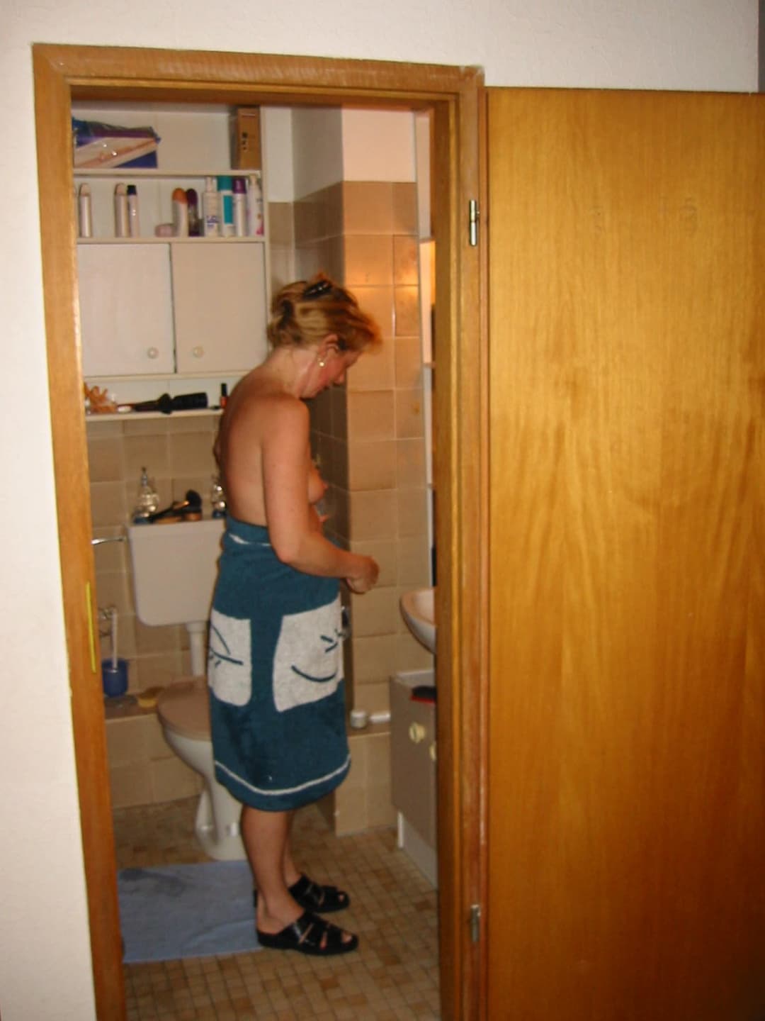 Old slut gets ready for friends in the bathroom