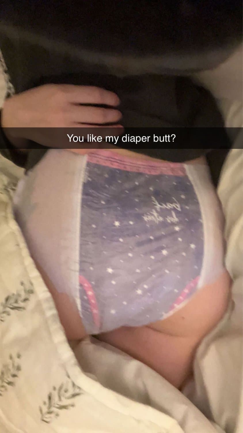 Cute tanned girl shows off her diapers and pull-ups