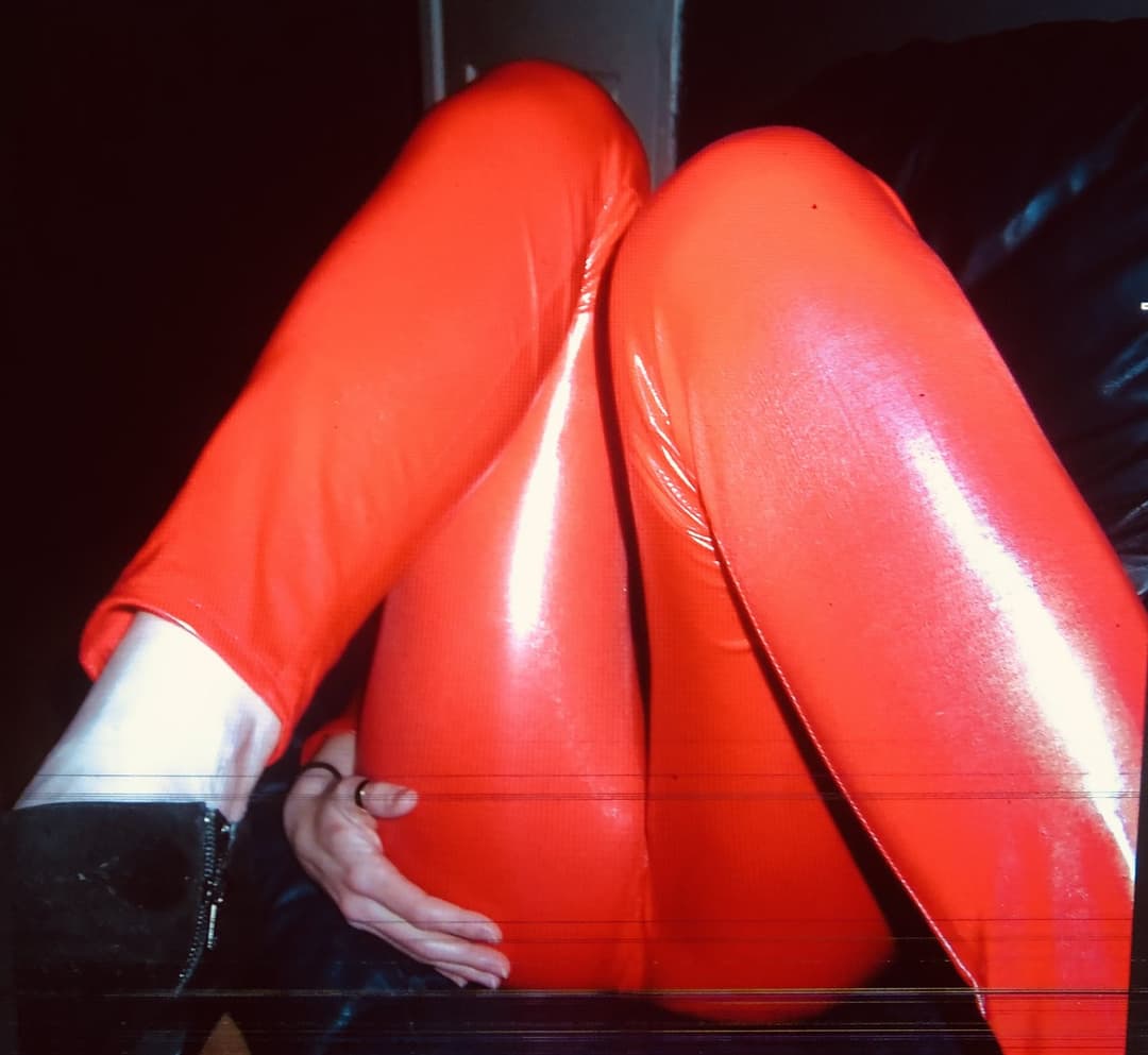 English petite biker milf in red pvc catsuit strips naked again tattoos and pierced nipples