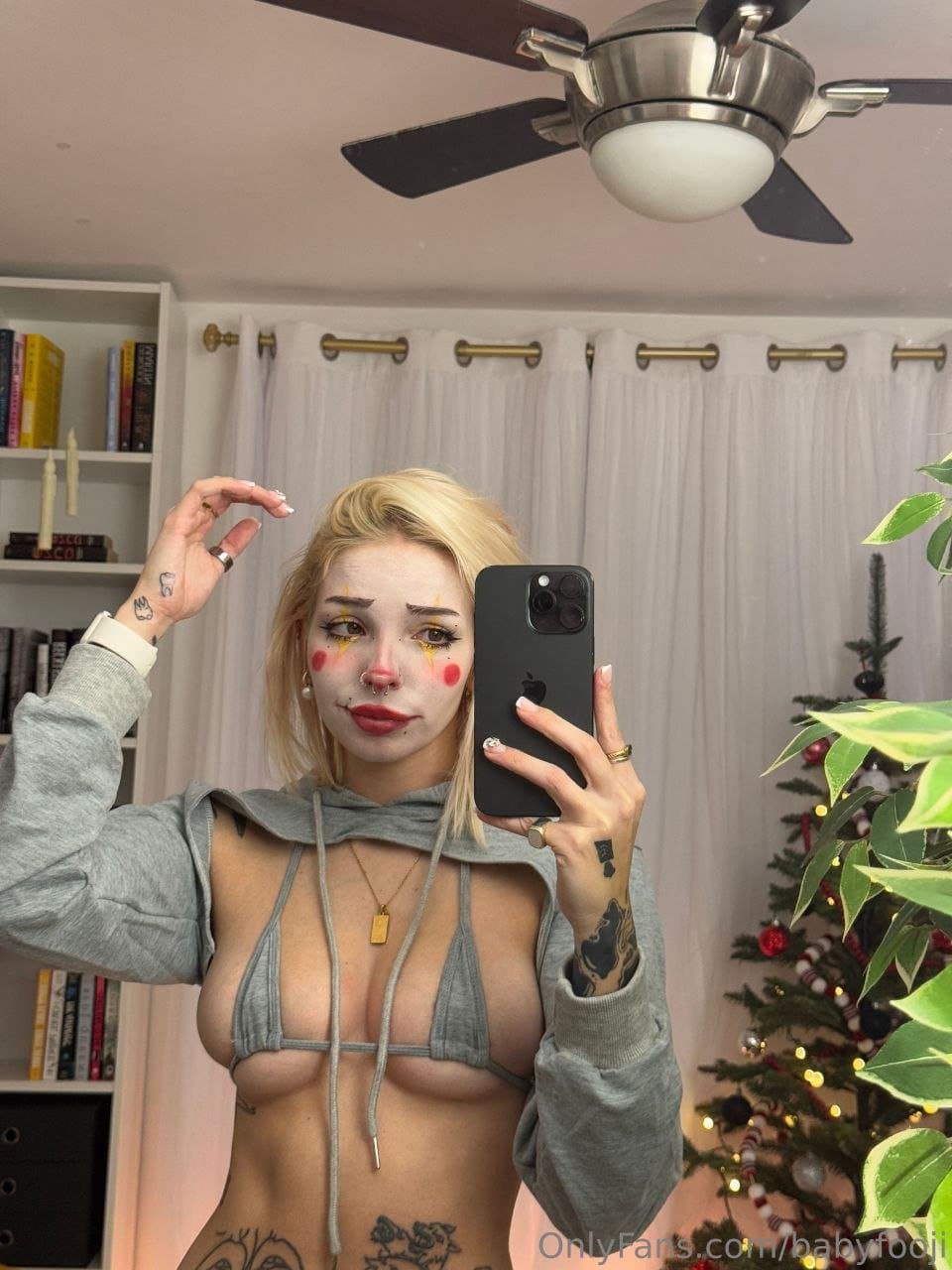 Naughty clown playing with her pussy