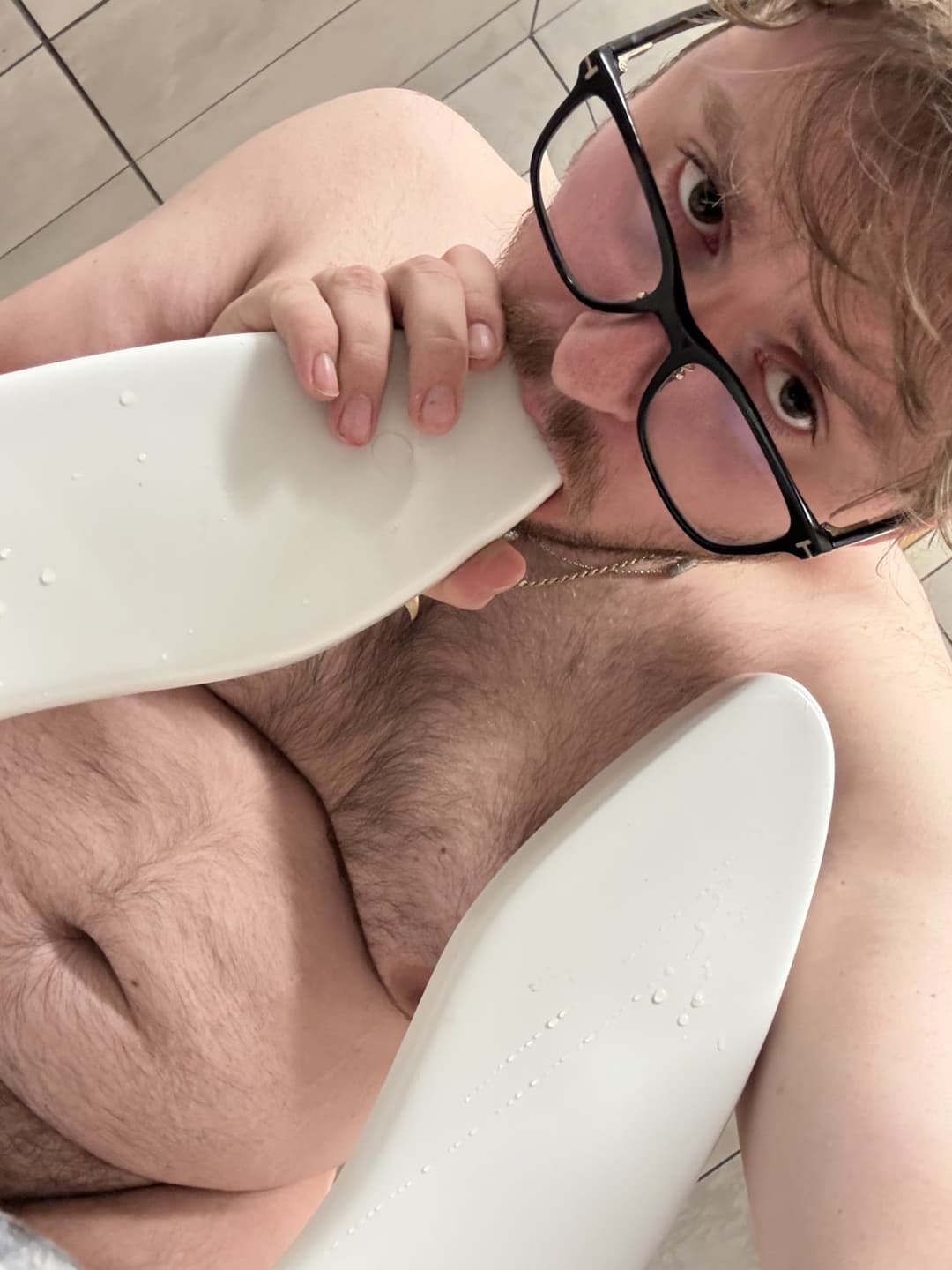 Zachary Tolksdorf licks a toliet and sucks on the seat