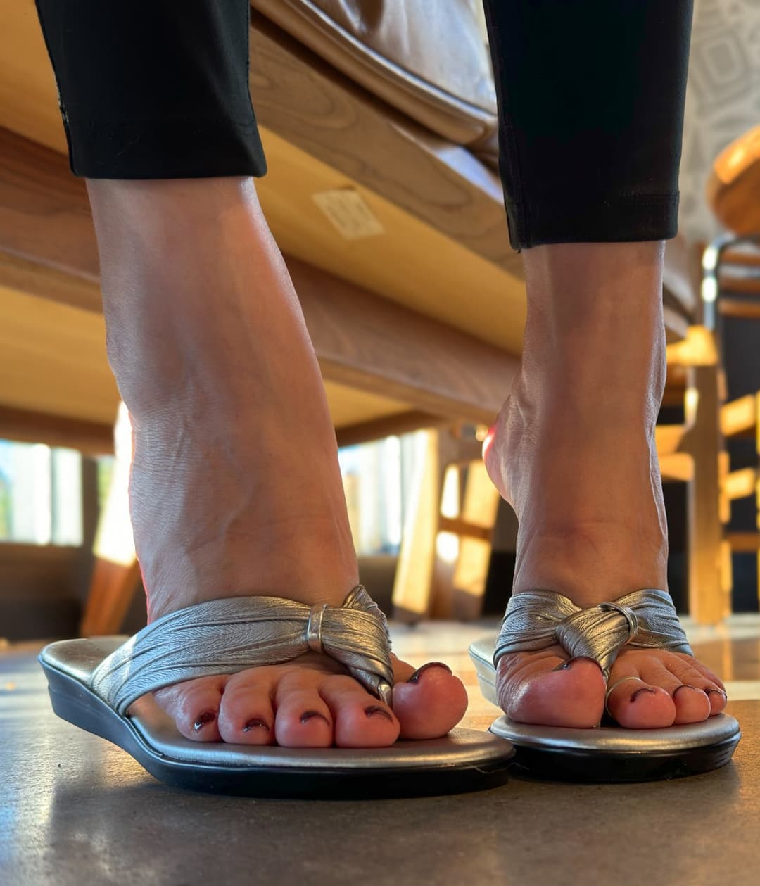 Moms friend in metallic flip flops