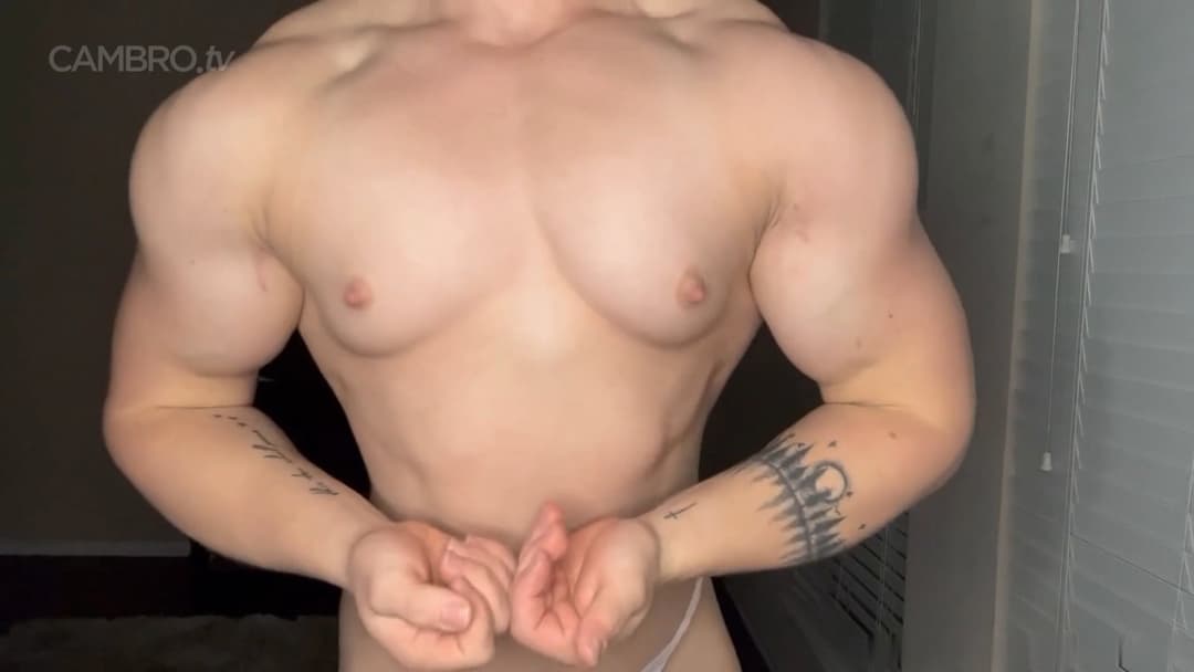 Muscular nudist performing a spermatic bodybuilding show