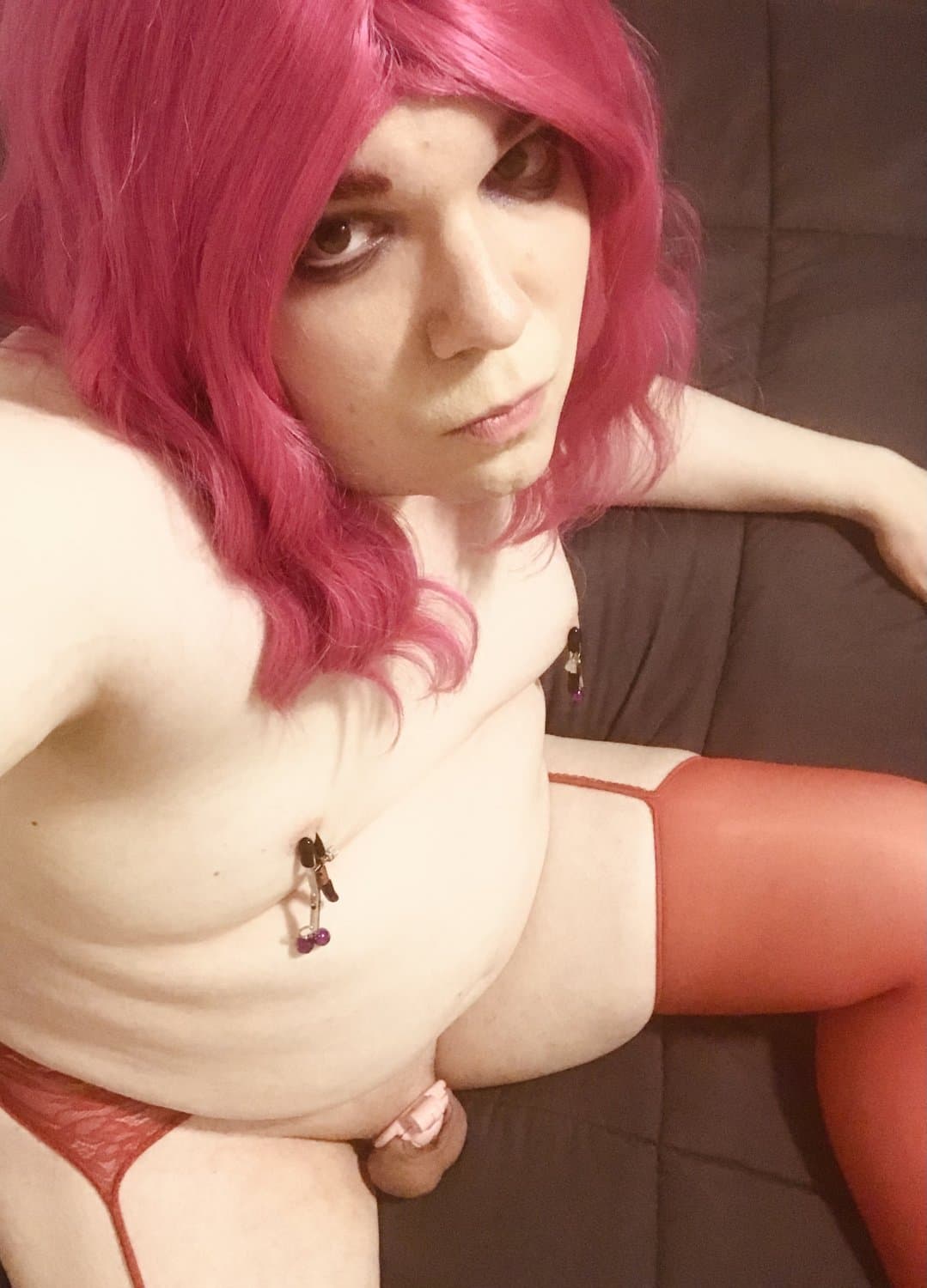 Donna the sissy slut in red suspender stockings