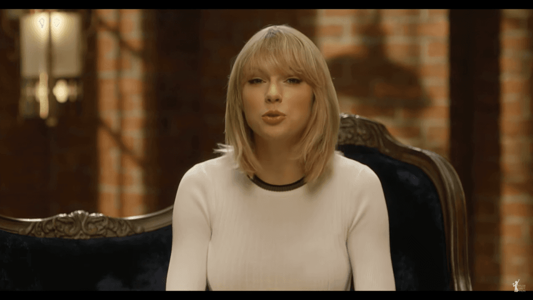 Taylor Swift tight white sweater, leather skirt, leather heels