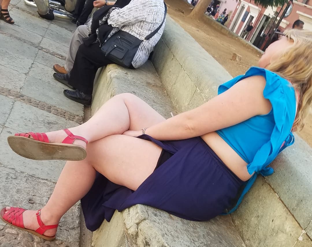 blonde sitting, legs open, nice thick legs