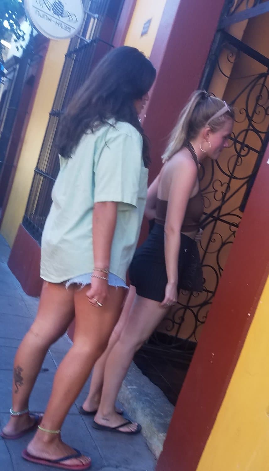 2 friends, blonde and brunette, in shorts, nice legs