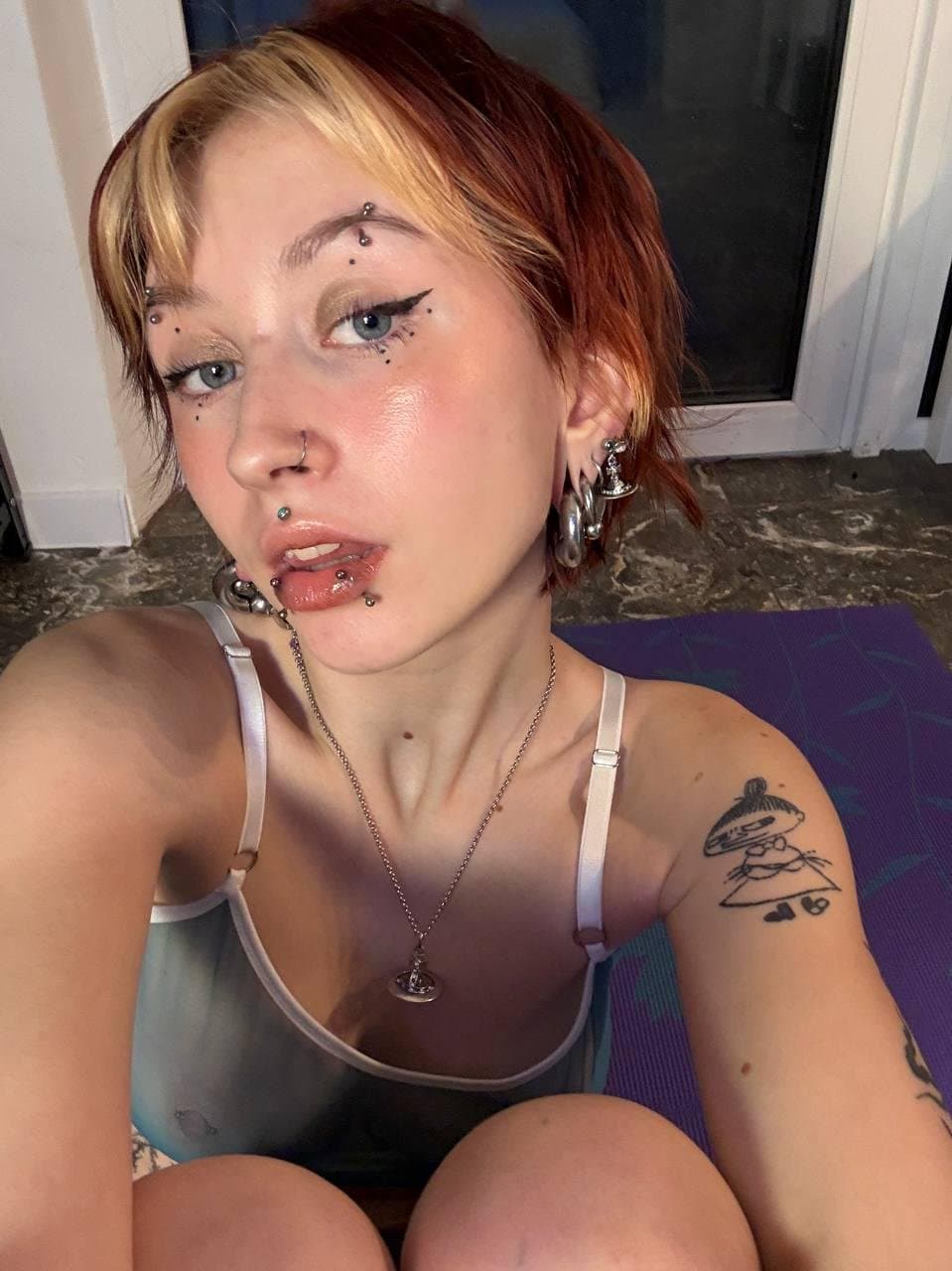 Some busty pierced braless woman ???