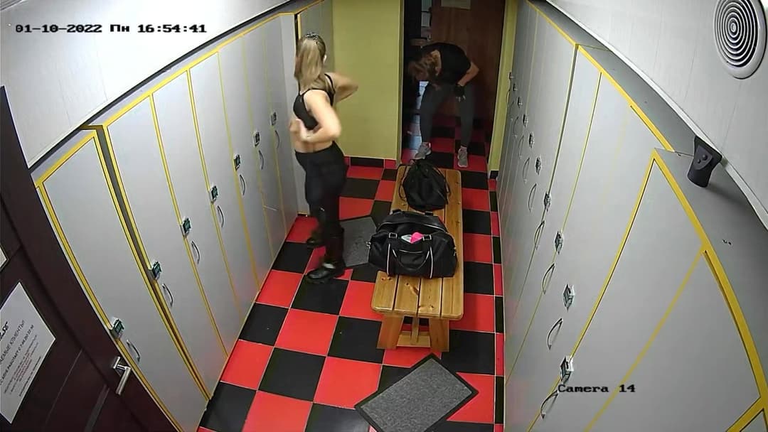 Woman trying to hide saggy little tits from her friend in locker room