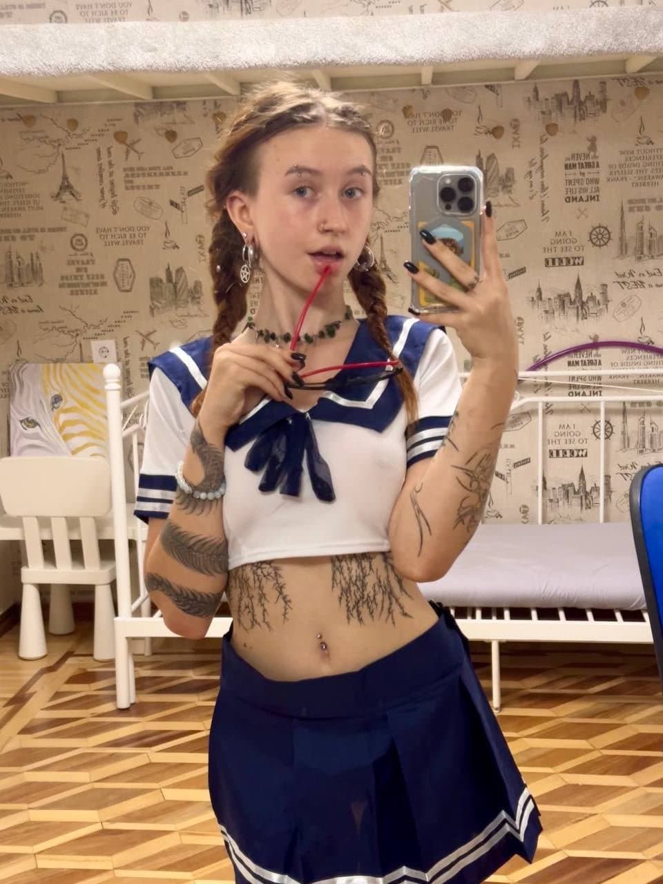 Some busty pierced braless woman ???