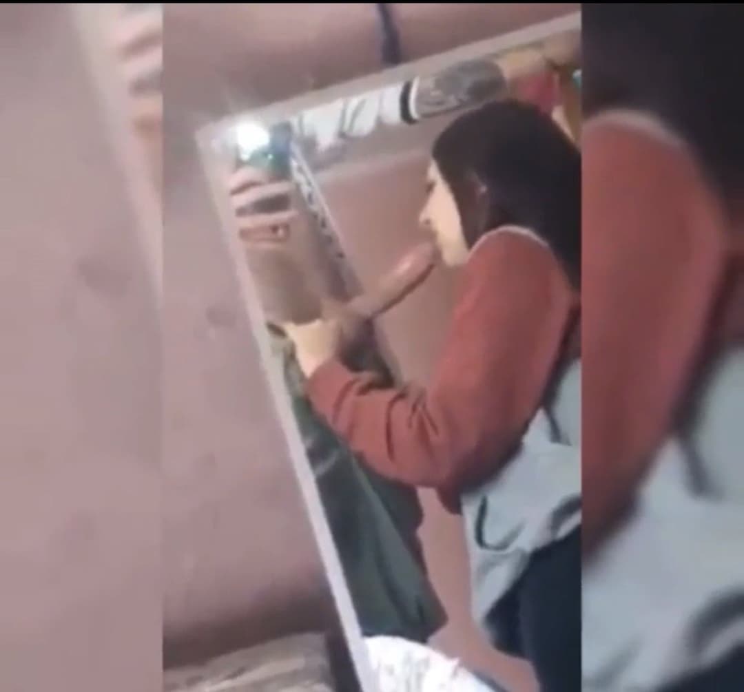 Latina girlfriend giving an amazing blowjob in front of the mirror