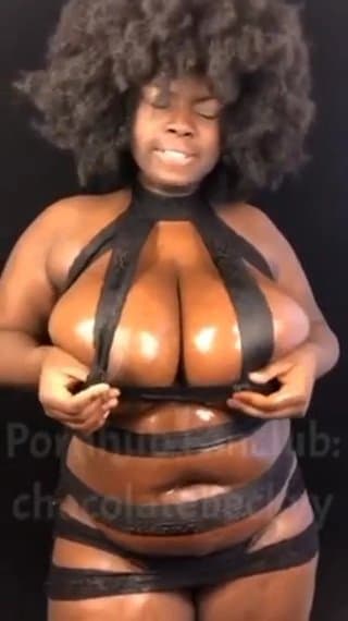 Massive oiled ebony boobs