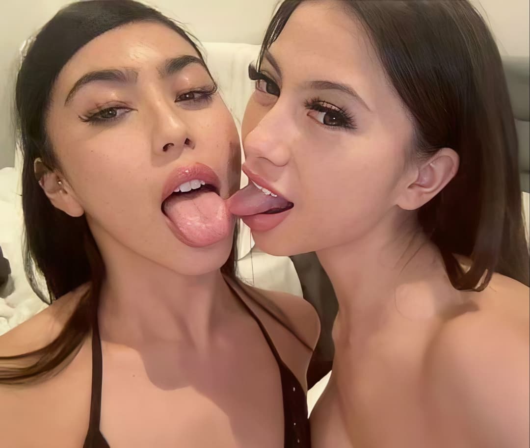 Pretty friends, a hot and horny brunette Latina and busty Asian slut, are making out