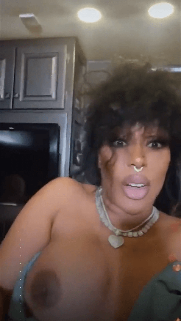 Click to view full size Busty Singer K. Michelle Nipple Slip ?