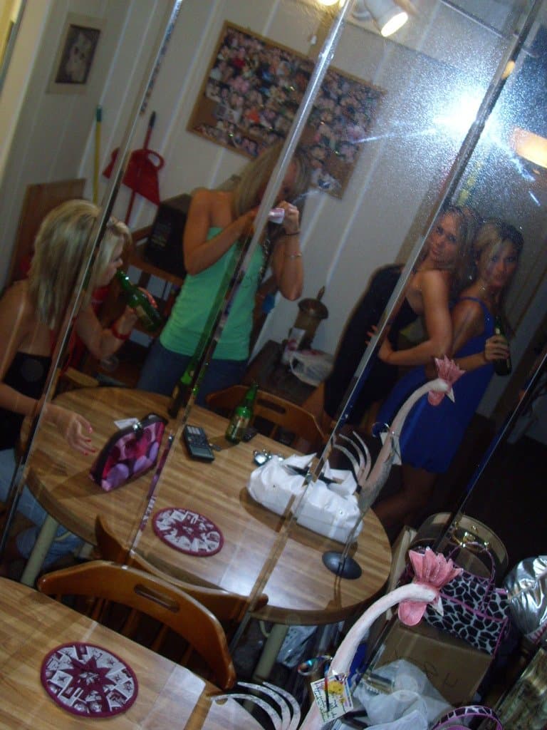 Sorority girls pre-game drink in the dorm room