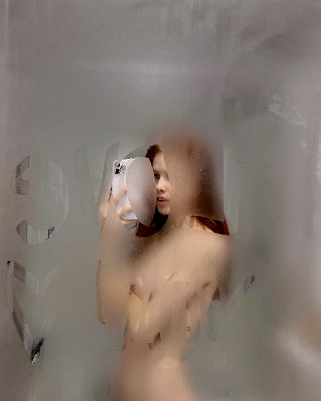 Ginger slut shows her small boobs