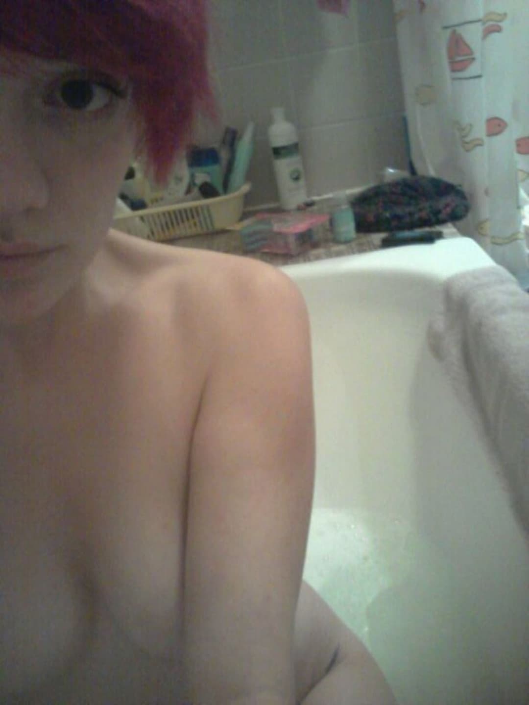 Emo redhead with perky tits teases for the camera