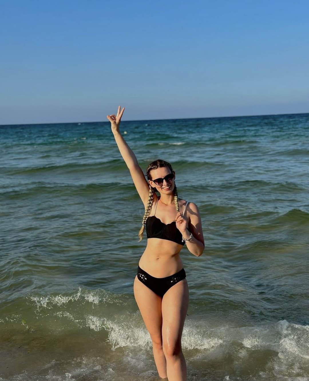 Cute little blonde Emilia Martis on the beach