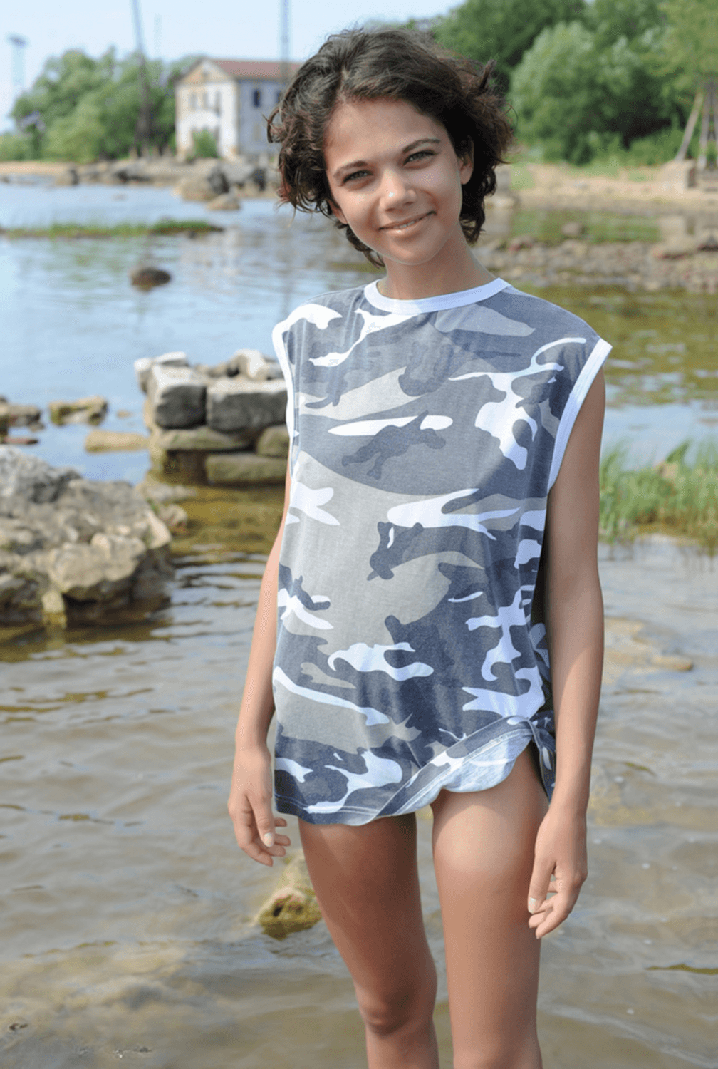 Flat-chested slut Tina naked in shallow water