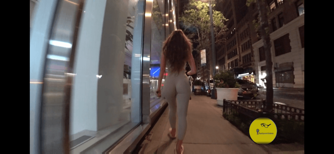 Big booty jiggly Latina in tight leggings walking around the street
