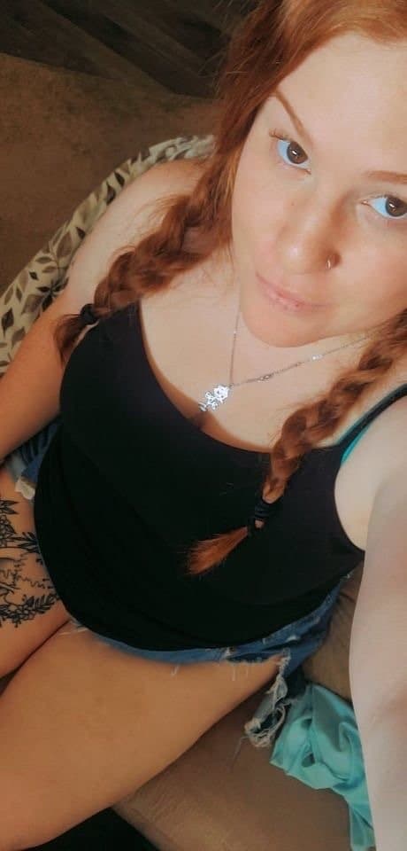 Big titty red head milf showing off big ass and tits.