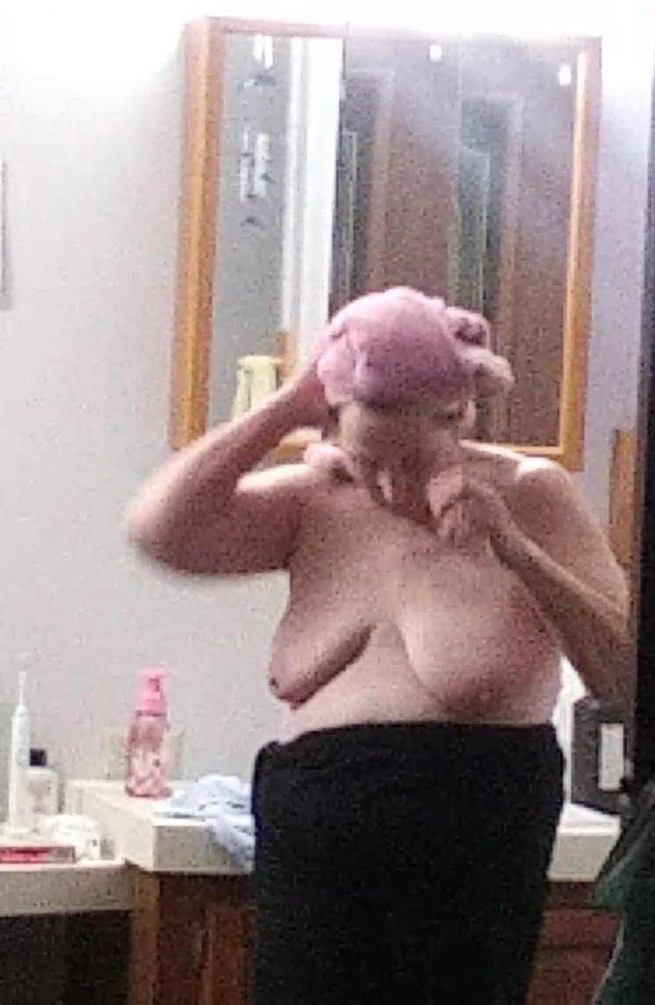 Peeking at my 60-year-old mother getting dressed after taking a shower.