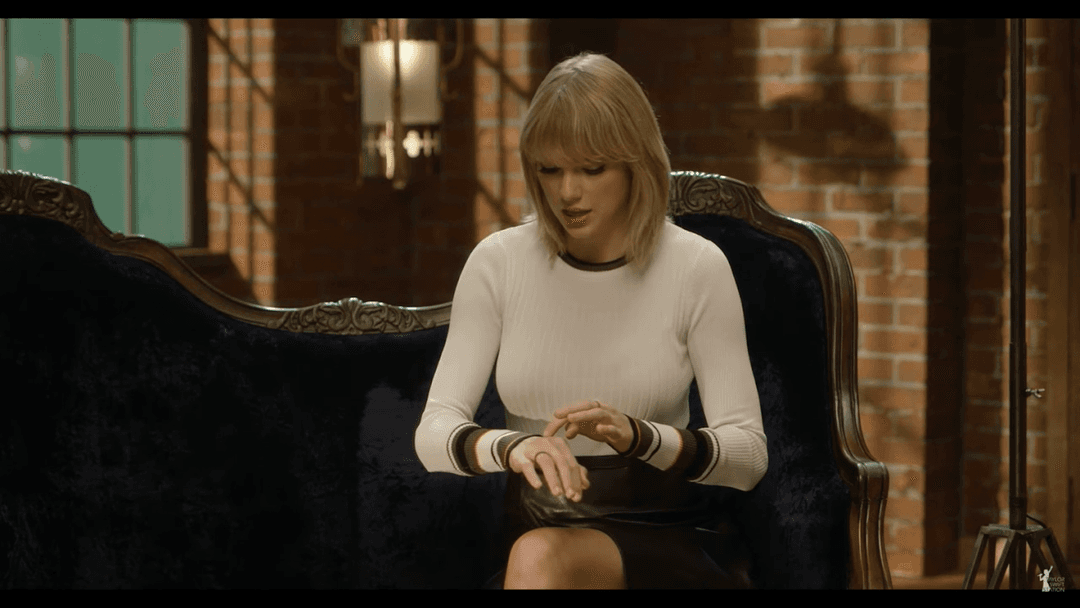 Taylor Swift tight white sweater, leather skirt, leather heels