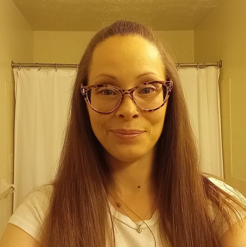 Click to view full size Tricia sneaks off to give a quick look at her titties