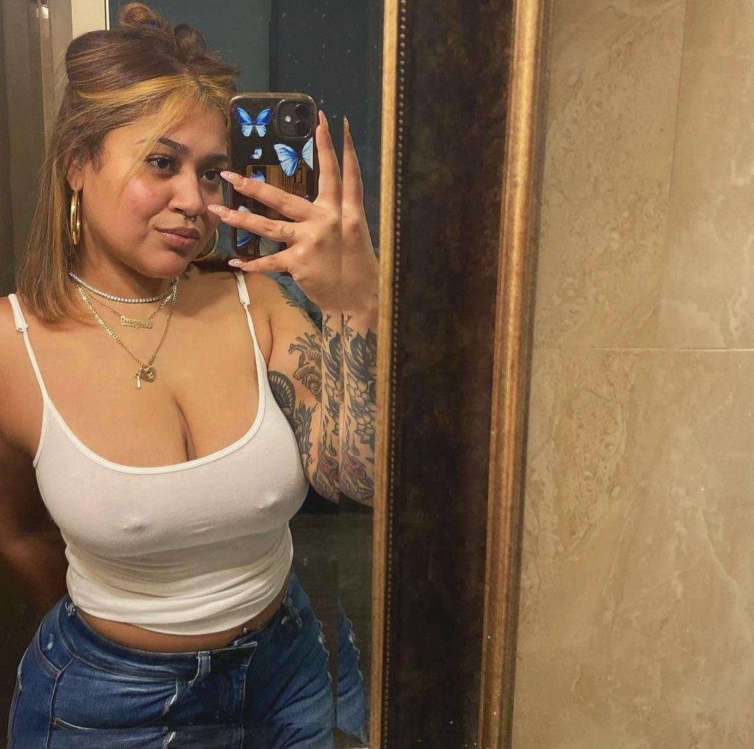 Some busty pierced braless woman ???