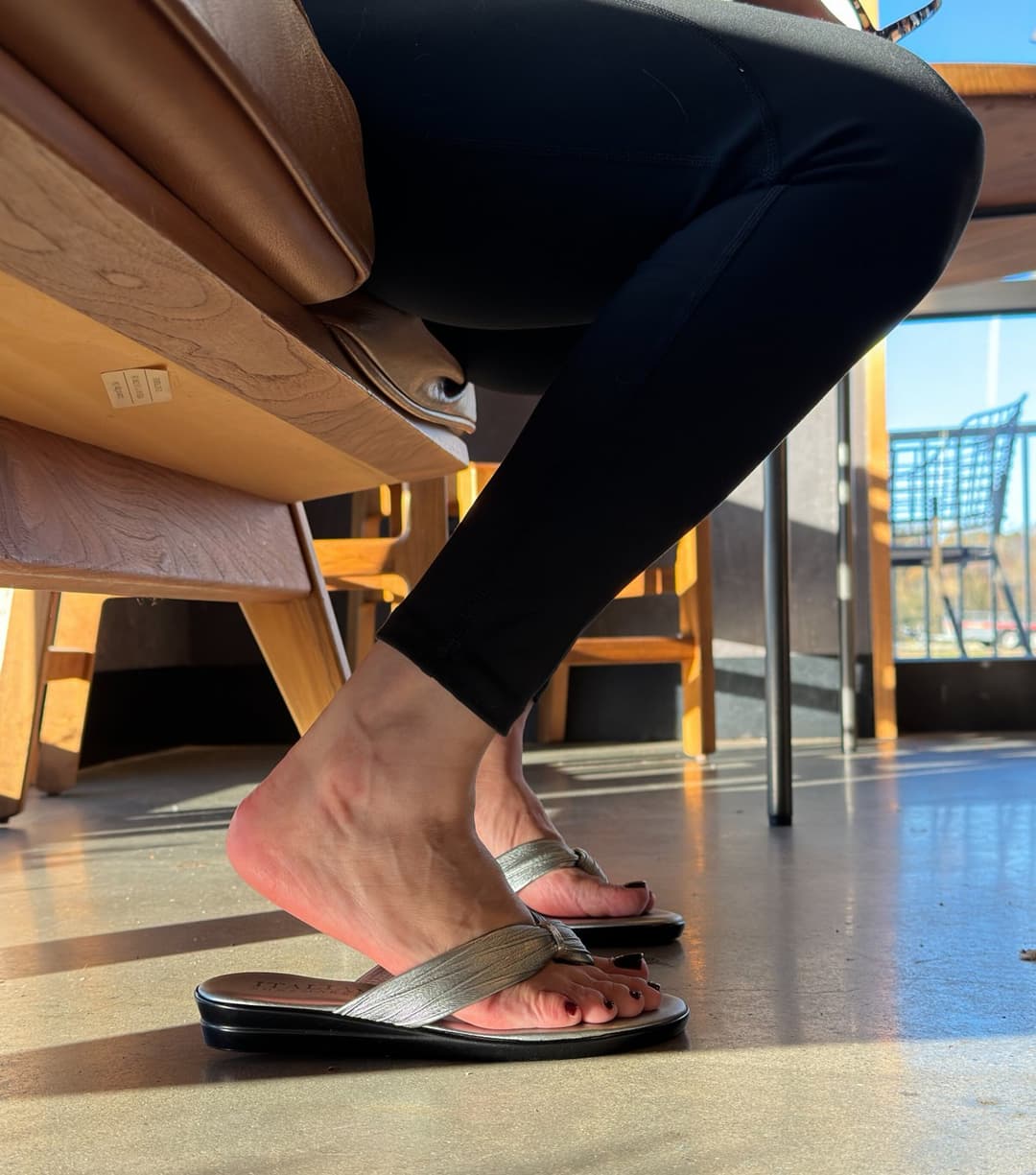 Moms friend in metallic flip flops