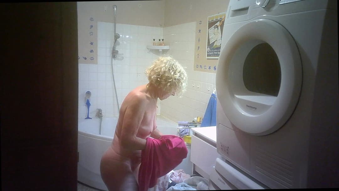 Two hidden cams for nurse Solange braless