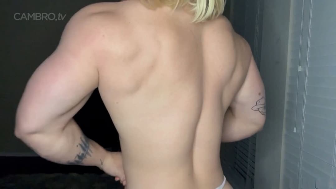 Muscular nudist performing a spermatic bodybuilding show