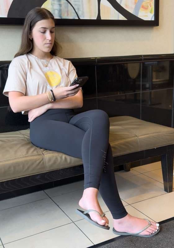 Brunette with white toes and black leggings creepshot